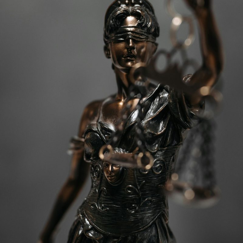 pexels-photo-8112195-8112195 Detailed bronze statue of Lady Justice with scales, symbolizing law and justice.